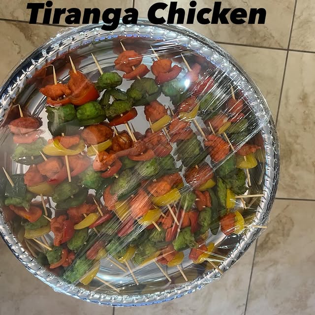 Colorful platter of Tiranga chicken skewers
